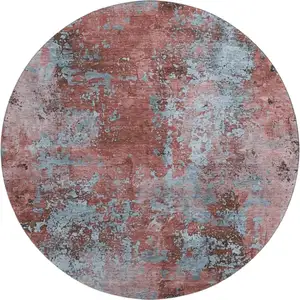 Photo of 8' Coral And Blue Abstract Washable Round Rug With UV Protection