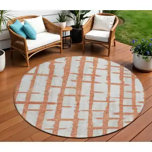 Photo of 8' Coral And Gray Round Striped Washable Indoor Outdoor Area Rug