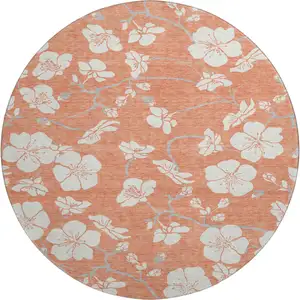 Photo of 8' Coral And Ivory Floral Washable Round Rug With UV Protection