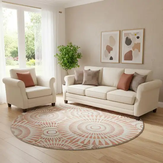 8' Coral And Ivory Geometric Washable Round Rug With UV Protection Photo 1