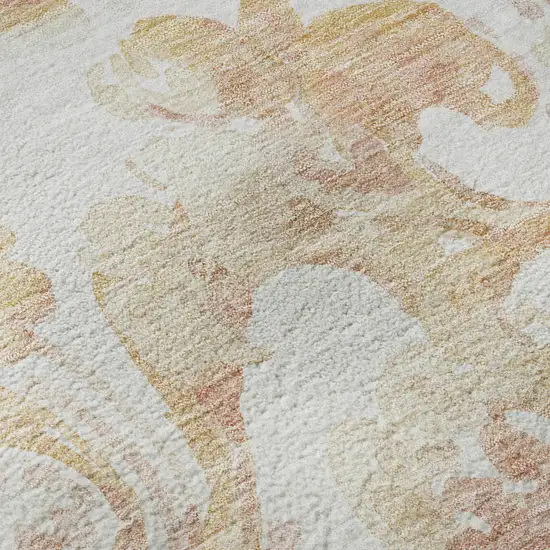 8' Coral And Ivory Paisley Washable Round Rug With UV Protection Photo 9