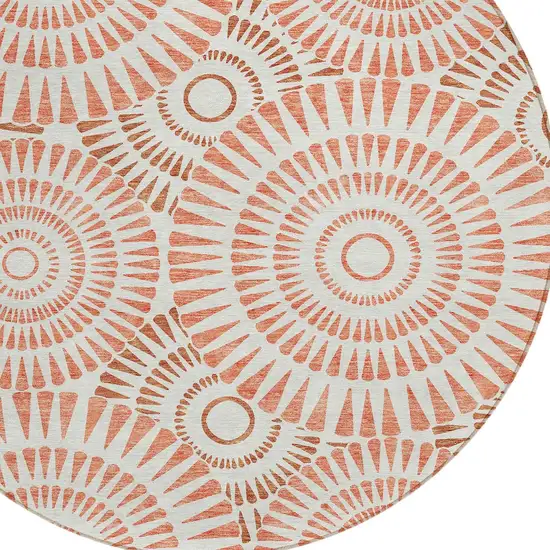 8' Coral And Ivory Round Geometric Washable Indoor Outdoor Area Rug Photo 5
