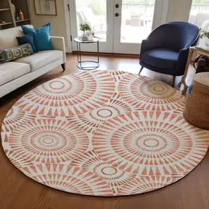 Photo of 8' Coral And Ivory Round Geometric Washable Indoor Outdoor Area Rug