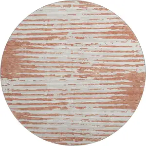 Photo of 8' Coral And Ivory Striped Washable Round Rug With UV Protection