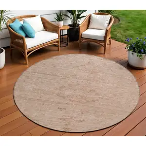 Photo of 8' Coral And Tan Round Floral Washable Indoor Outdoor Area Rug