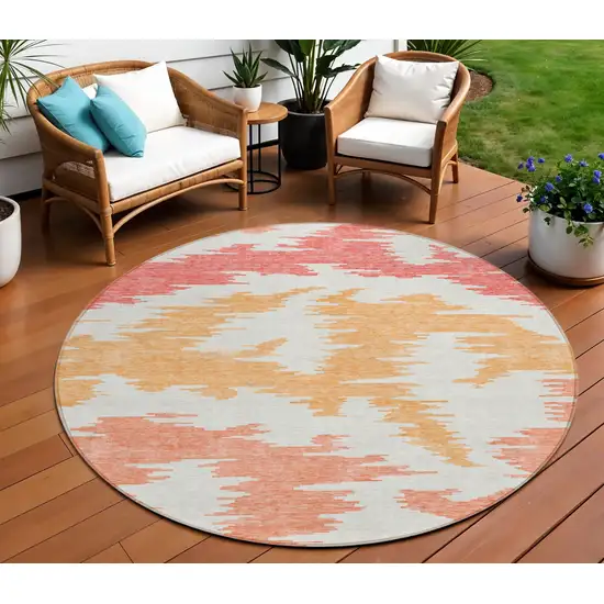8' Coral Beige And Orange Round Abstract Washable Indoor Outdoor Area Rug Photo 1