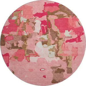 Photo of 8' Coral Pink And Ivory Abstract Washable Round Rug With UV Protection