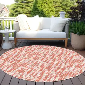 Photo of 8' Coral Pink And Ivory Round Abstract Washable Indoor Outdoor Area Rug