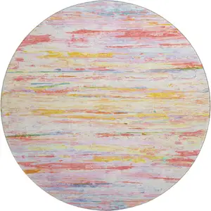 Photo of 8' Coral Yellow And Ivory Abstract Washable Round Rug With UV Protection