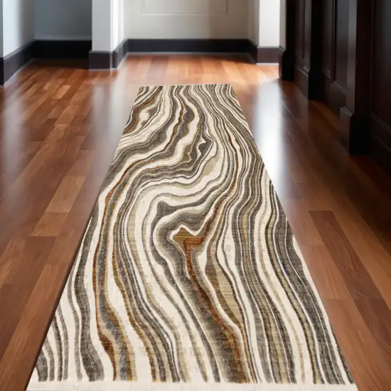 8' Cream And Beige Abstract Runner Rug Photo 1
