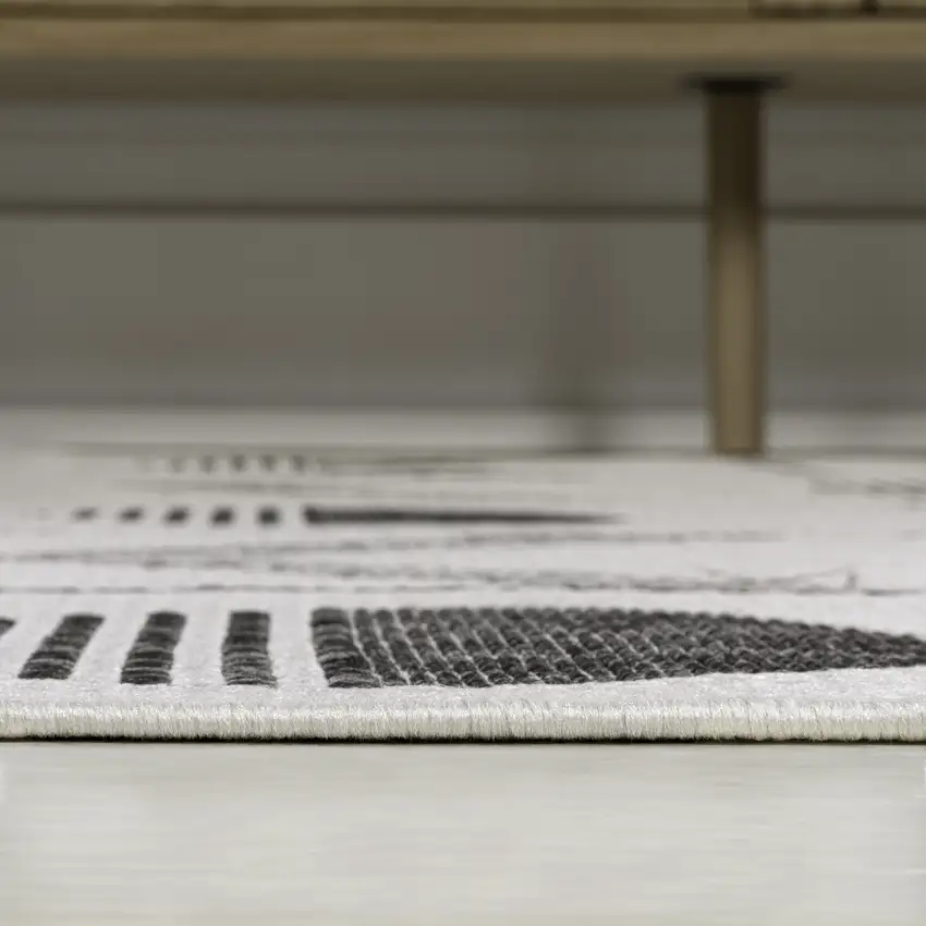 8' Cream And Black Geometric Indoor Outdoor Runner Rug Photo 7