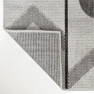 Photo of 8' Cream And Black Geometric Indoor Outdoor Runner Rug