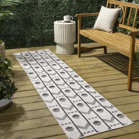 8' Cream And Black Geometric Indoor Outdoor Runner Rug Photo 5