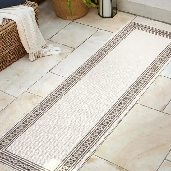 8' Cream And Black Indoor Outdoor Runner Rug Photo 2
