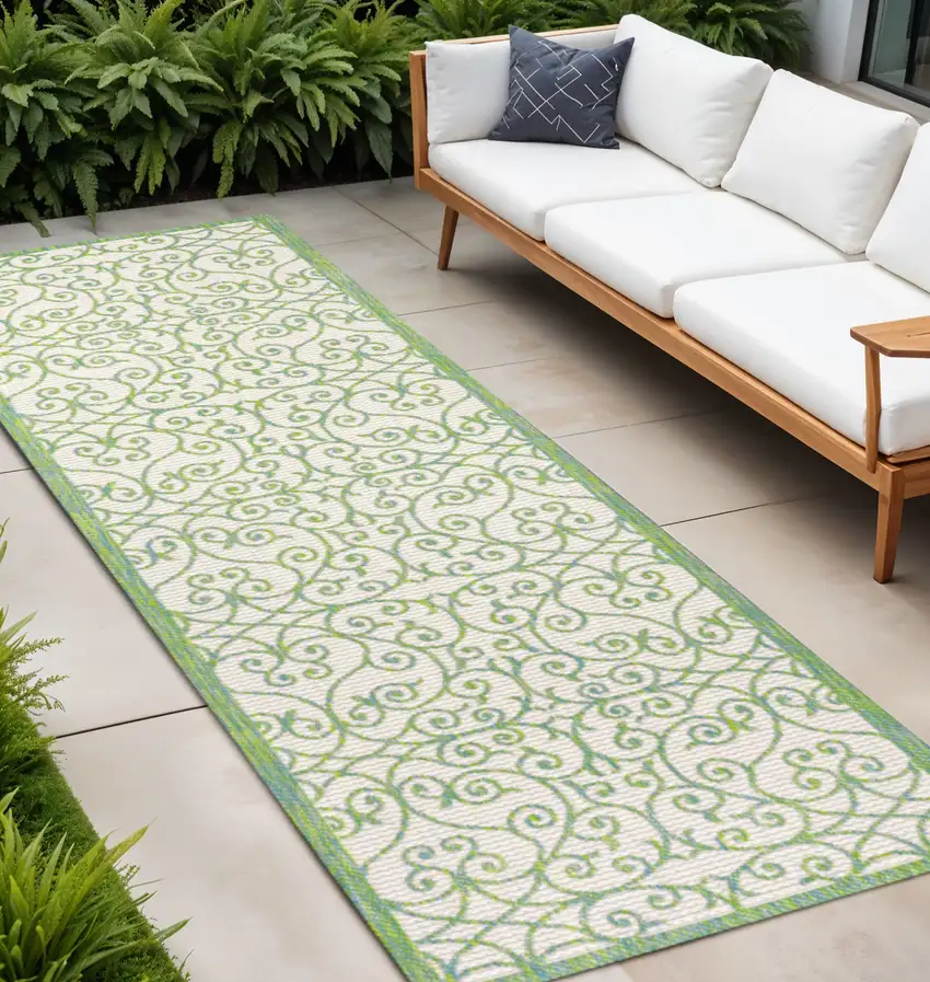 8' Cream And Green Geometric Indoor Outdoor Runner Rug Photo 1