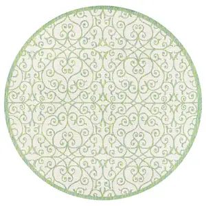 Photo of 5' Cream And Green Round Geometric Indoor Outdoor Area Rug