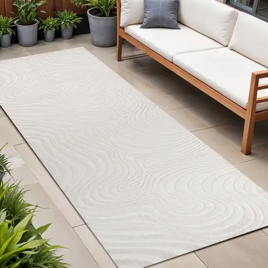10' Cream And Ivory Abstract Indoor Outdoor Runner Rug Photo 1