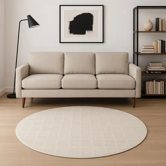 8' Cream And Ivory Geometric Round Rug Photo 1