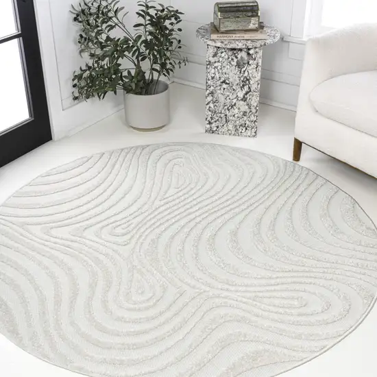 7' Cream And Ivory Round Abstract Indoor Outdoor Area Rug Photo 4
