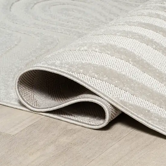 8' Cream And Ivory Round Abstract Indoor Outdoor Area Rug Photo 9