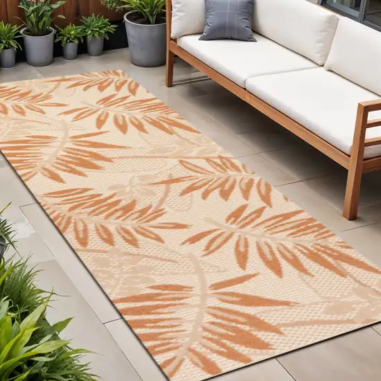 8' Cream And Orange Floral Indoor Outdoor Runner Rug Photo 1