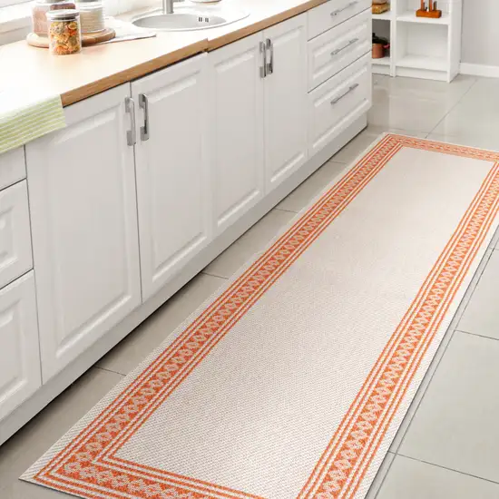 8' Cream And Orange Indoor Outdoor Runner Rug Photo 6