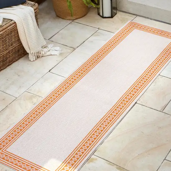 8' Cream And Orange Indoor Outdoor Runner Rug Photo 5
