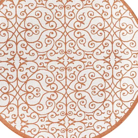 5' Cream And Orange Round Geometric Indoor Outdoor Area Rug Photo 2