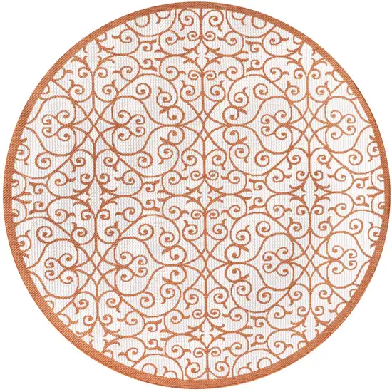 5' Cream And Orange Round Geometric Indoor Outdoor Area Rug Photo 1