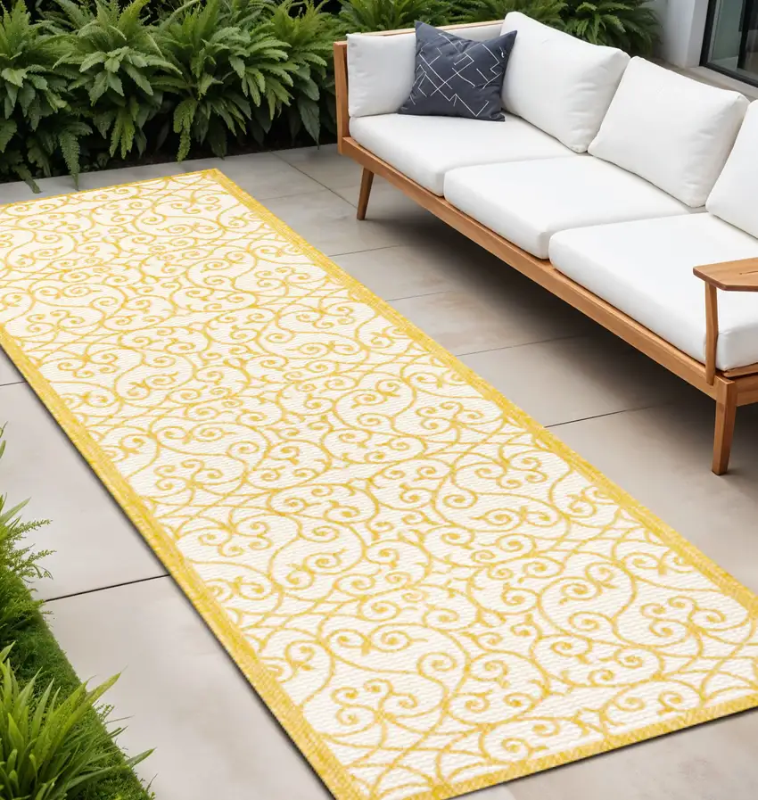 10' Cream And Yellow Geometric Indoor Outdoor Runner Rug Photo 1