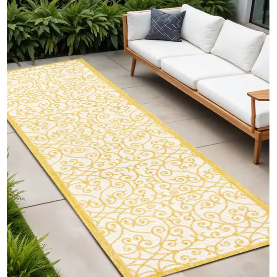 8' Cream And Yellow Geometric Indoor Outdoor Runner Rug Photo 1