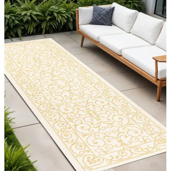 10' Cream And Yellow Medallion Indoor Outdoor Runner Rug Photo 1