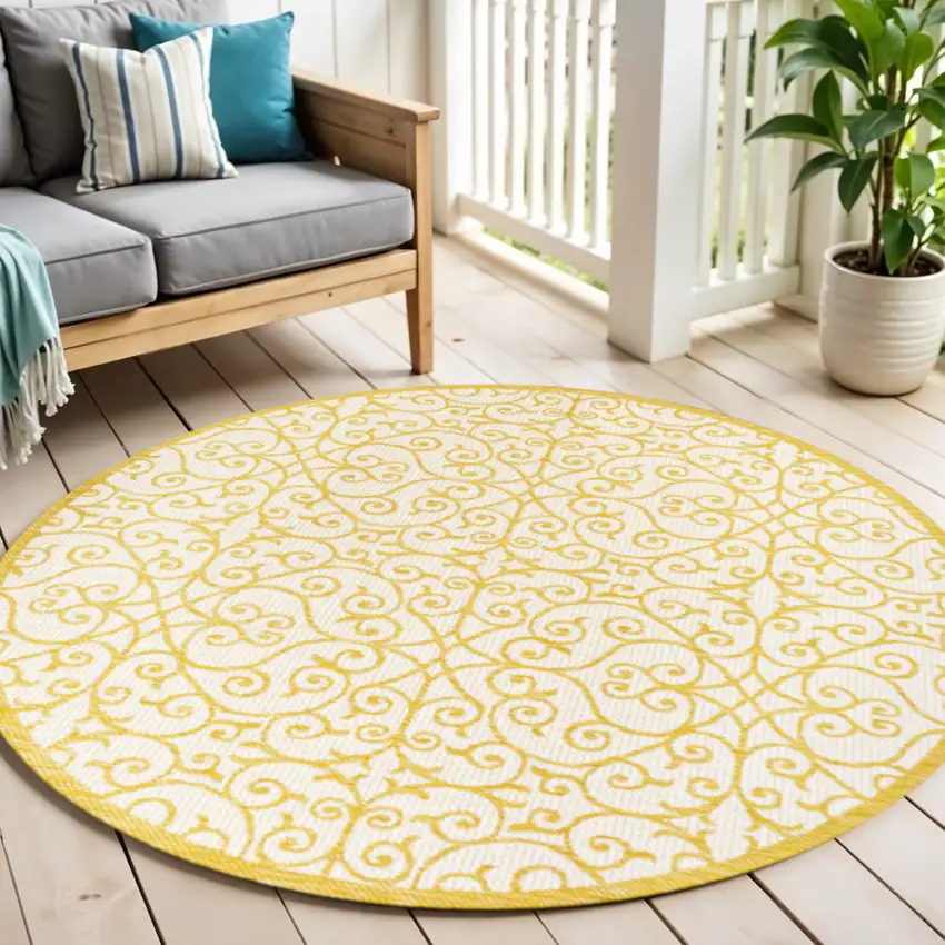 5' Cream And Yellow Round Geometric Indoor Outdoor Area Rug Photo 1