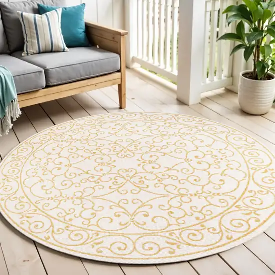 5' Cream And Yellow Round Medallion Indoor Outdoor Area Rug Photo 1