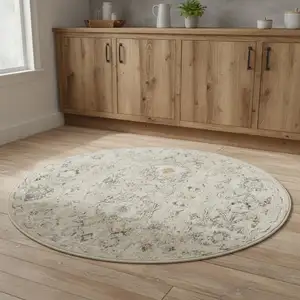 Photo of 4' Cream Black And Yellow Floral Distressed Round Rug