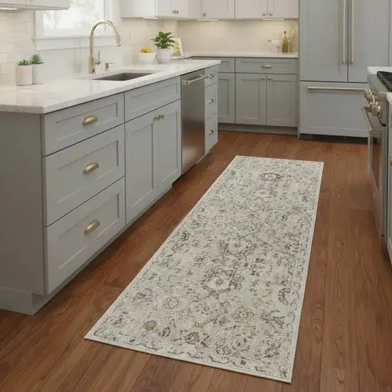 8' Cream Black And Yellow Floral Distressed Runner Rug Photo 1