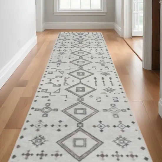 10' Cream Geometric Distressed Washable Runner Rug Photo 1