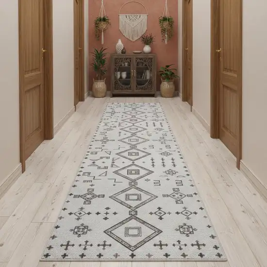 10' Cream Geometric Distressed Washable Runner Rug Photo 1