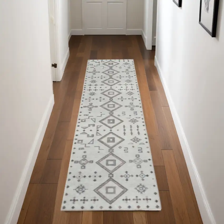 8' Cream Geometric Distressed Washable Runner Rug Photo 1