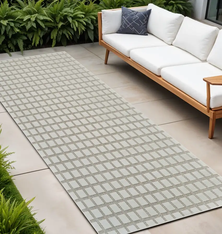 10' Cream and Beige Geometric Distressed Indoor Outdoor Runner Rug Photo 1