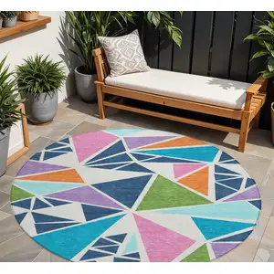 Photo of 8' Dark Blue Green And Pink Round Geometric Washable Indoor Outdoor Area Rug