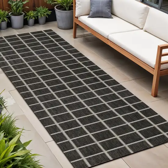 8' Dark Gray And Cream Plaid Indoor Outdoor Runner Rug Photo 1