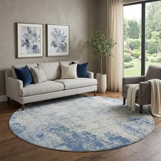 8' Denim Blue And Ivory Abstract Washable Round Rug With UV Protection Photo 1