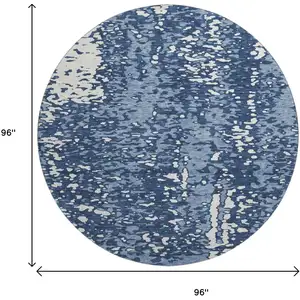 Photo of 8' Denim Blue And Ivory Abstract Washable Round Rug With UV Protection