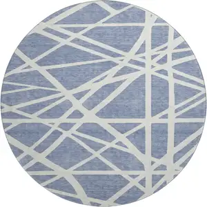 Photo of 8' Denim Blue And Ivory Geometric Washable Round Rug With UV Protection