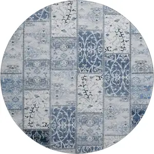 Photo of 8' Denim Blue And Ivory Patchwork Washable Round Rug With UV Protection