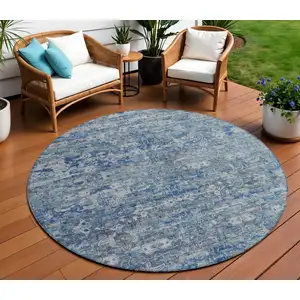 Photo of 8' Denim Blue And Ivory Round Ikat Washable Indoor Outdoor Area Rug