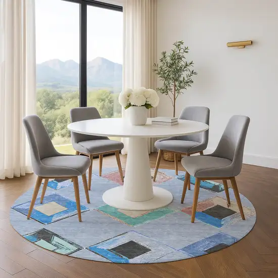 8' Denim Blue Charcoal And Mauve Geometric Washable Round Rug With UV Protection Photo 5
