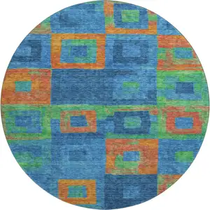 Photo of 8' Denim Blue Orange And Green Geometric Washable Round Rug With UV Protection