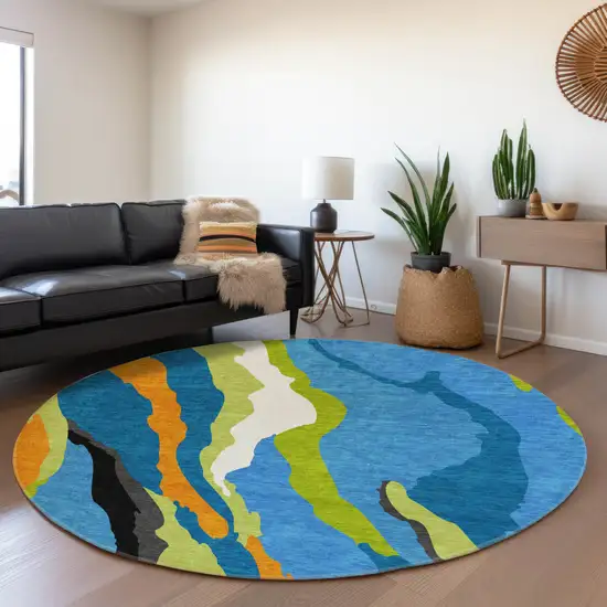 8' Denim Blue Orange And Lime Green Abstract Washable Round Rug With UV Protection Photo 4